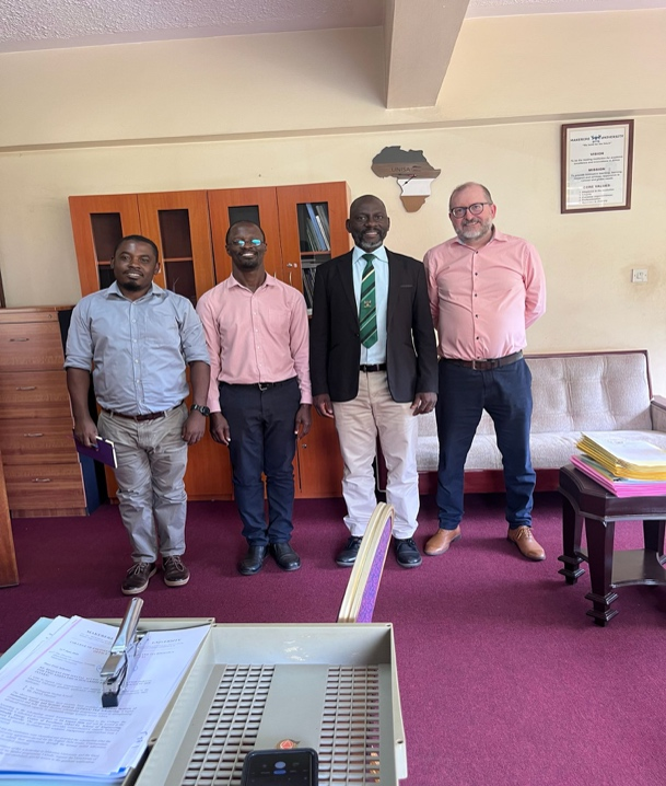 Dr. Ivan Mwebaza, Dr. Samuel Kirimunda, and Prof. Samuel Flores visiting the Director of Graduate Training and CIVIS Patron, Prof. Julius Kikooma