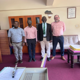 Dr. Ivan Mwebaza, Dr. Samuel Kirimunda, and Prof. Samuel Flores visiting the Director of Graduate Training and CIVIS Patron, Prof. Julius Kikooma